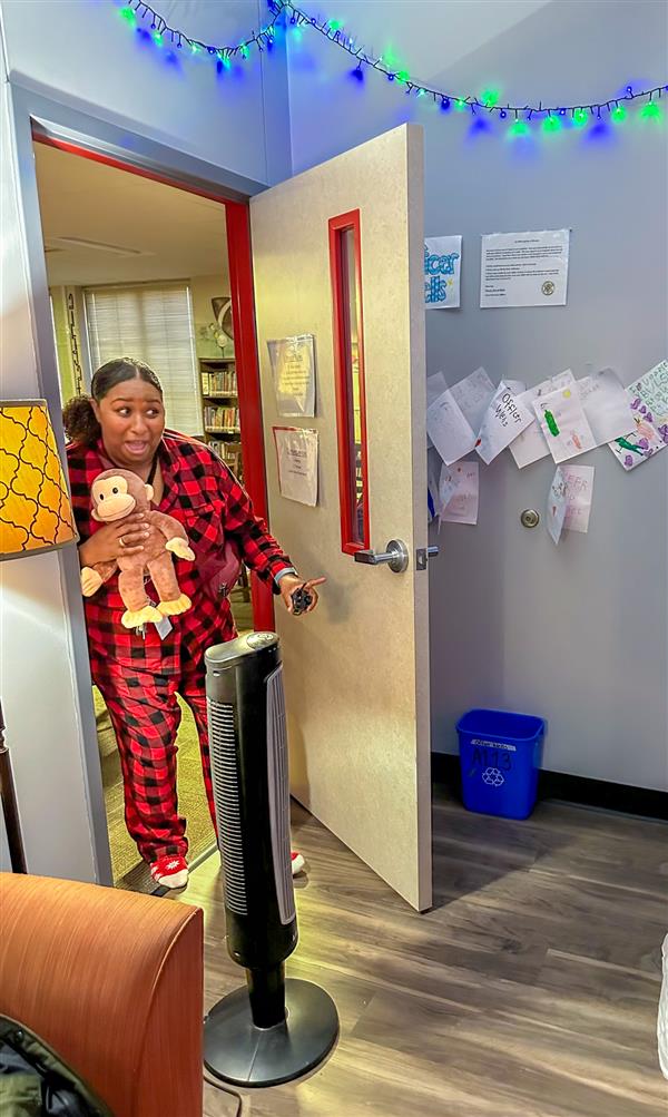 principal with monkey peeking into classroom